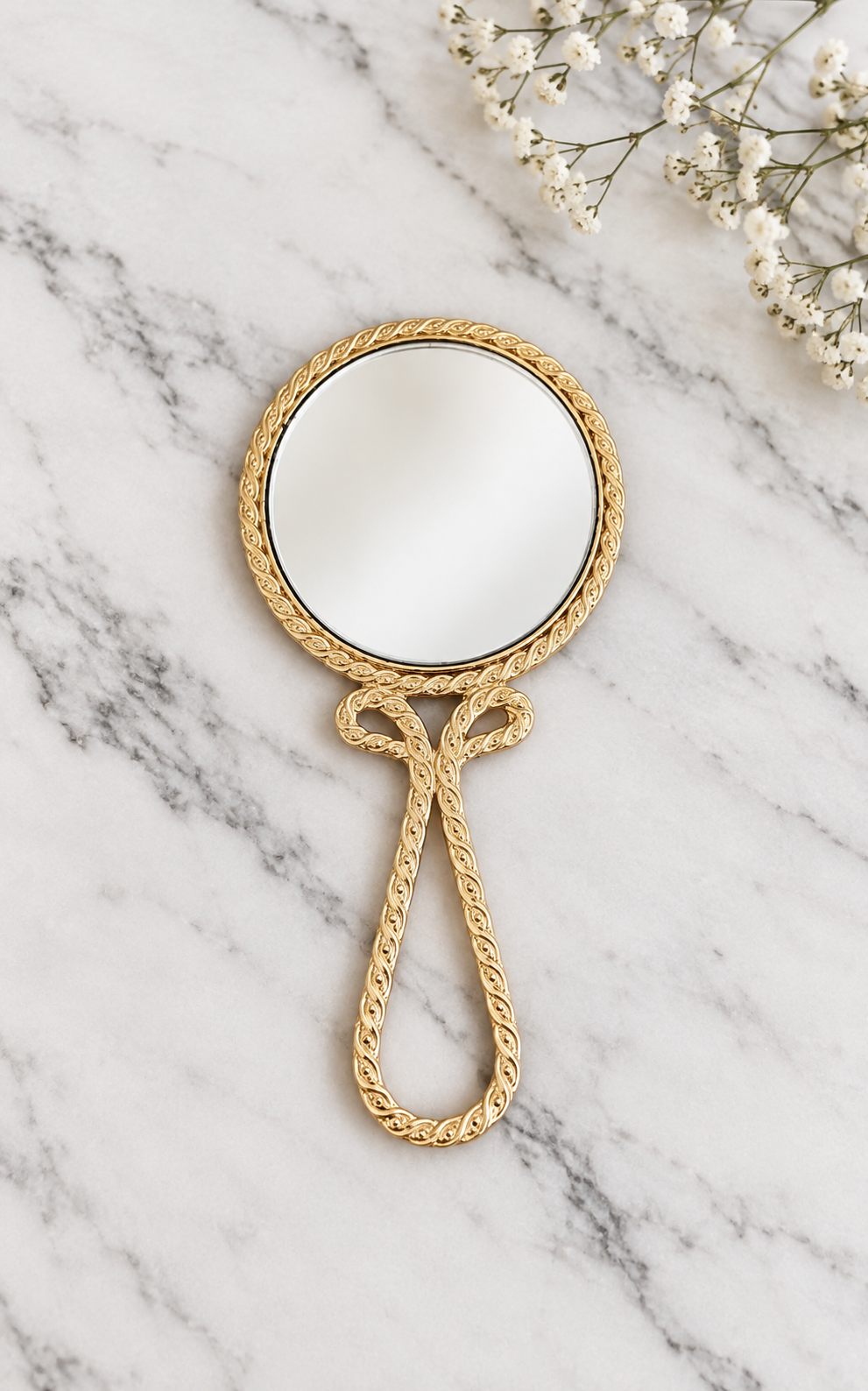 Miroir à main vintage en métal doré avec broderie florale violette au dos