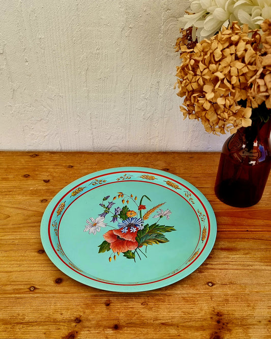 Plateau rond vintage en métal turquoise avec décor floral champêtre