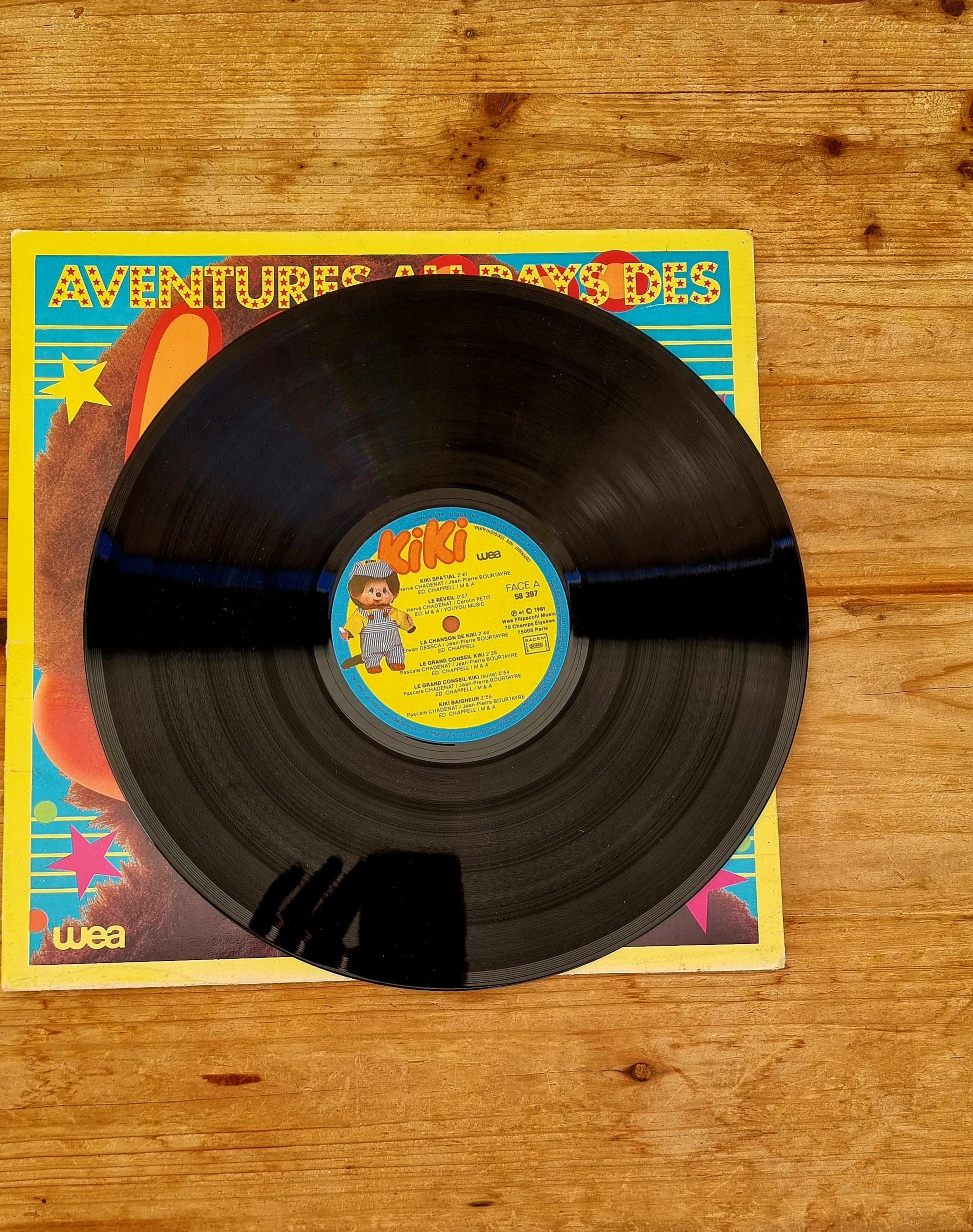 Vinyle vintage Kiki 33 tours Les Aventures au Pays des Kiki avec livret pop-up WEA
